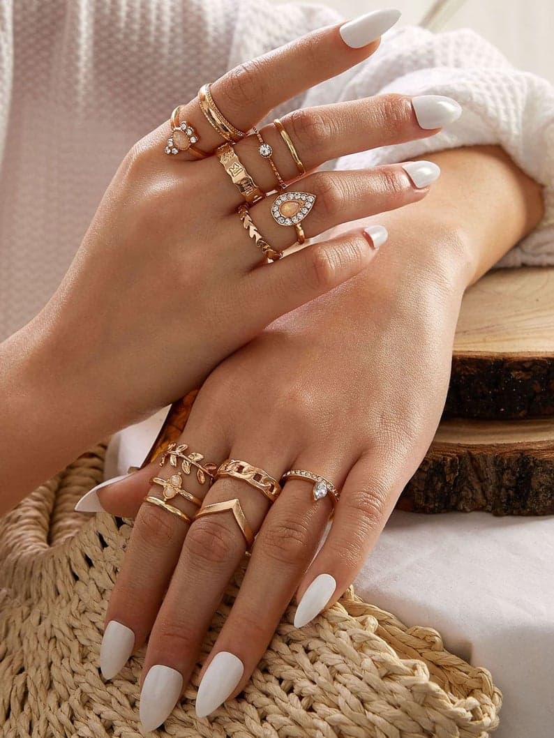 Woman in patterned top with arms raised